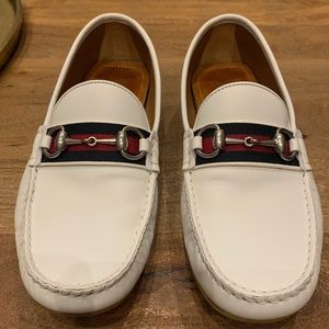 Men’s Gucci loafers. White leather, blue and red trim, and rubber sole. Size 7